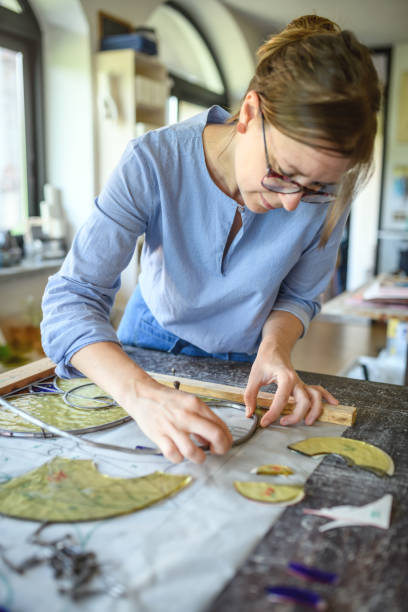 istock Glass artist craftswoman working in her studio 1323056716