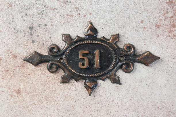 istock Old metal home number sign 1323057128