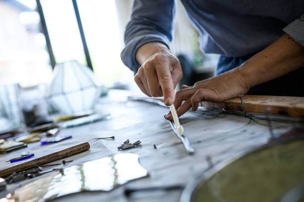 istock Glass artist craftswoman working in her studio 1323058276