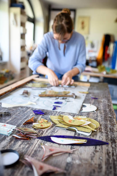 istock Glass artist craftswoman working in her studio 1323058907