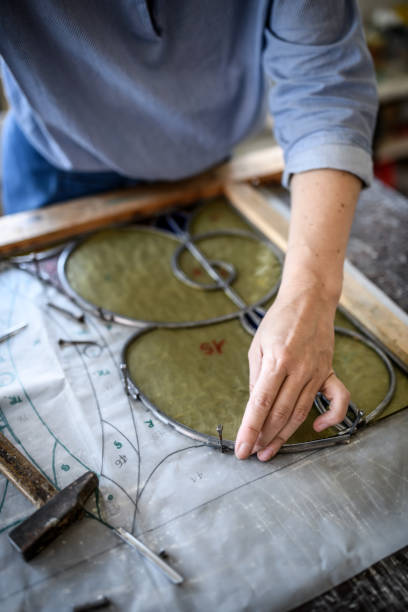 istock Glass artist craftswoman working in her studio 1323059160