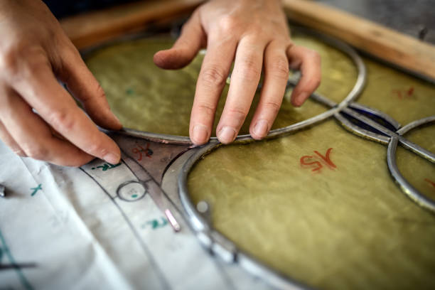 Glass artist craftswoman working in her studio
