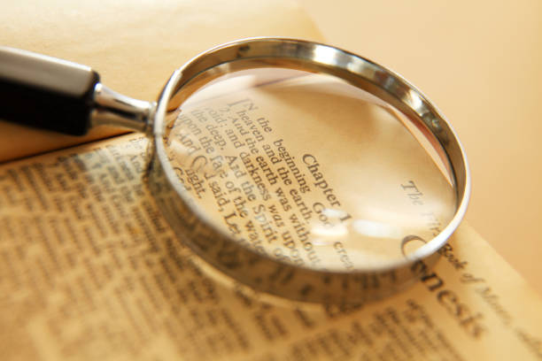 istock Magnifying Glass On Holy Bible 1323059953