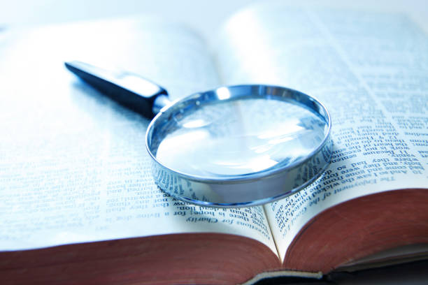 istock Magnifying Glass On Holy Bible 1323059955