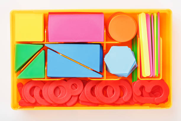 istock A box with Colorful plastic figures and numbers on a white background. Educational games for children. 1323060025