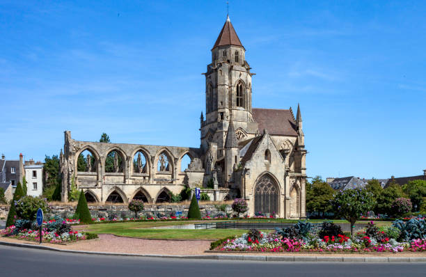 Although well landscaped and protected, the Church of Saint-Étienne-le-Vieux in Caen, France because of war damage it has been rebuilt several times in the last millennia, it is now still mostly in ruins because it was bombed by the Allies Although well landscaped and protected, the Church of Saint-Étienne-le-Vieux in Caen, France. because of war damage it has been rebuilt several times in the last millennia, it is now still mostly in ruins because it was bombed by the Allies during WWII.  This church has been classified as a historic monument since August 22, 1903 caen photos stock pictures, royalty-free photos & images