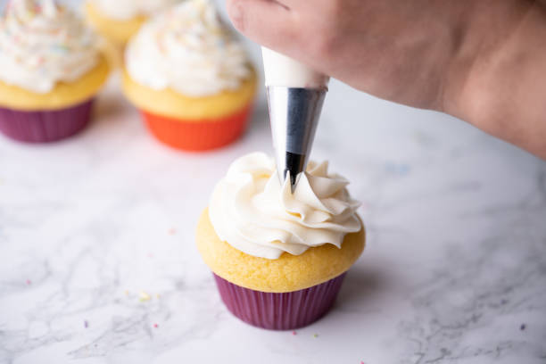 istock pipping flosting on colorful cupcake 1323063123