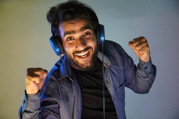 istock man feels music and happy mood 1323063221