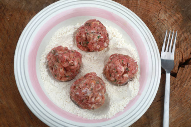 raw minced meat balls ready to cook