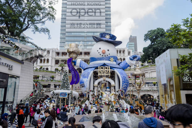 View of people walking around the place of Christmas celebration area in Kowloon, Hong Kong. stock photo