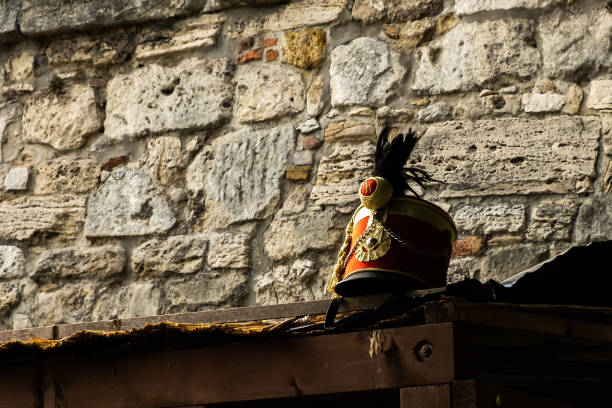 View of Busby on the roof next to the old wall, a military head-dress made of fur, originally worn by Hungarian hussars, at Buda Castle in  Budapest, Hungary. stock photo