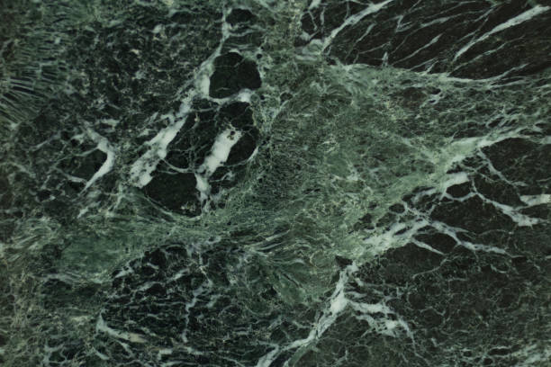 istock The dark green marble. Facing stone. Texture 1323066894