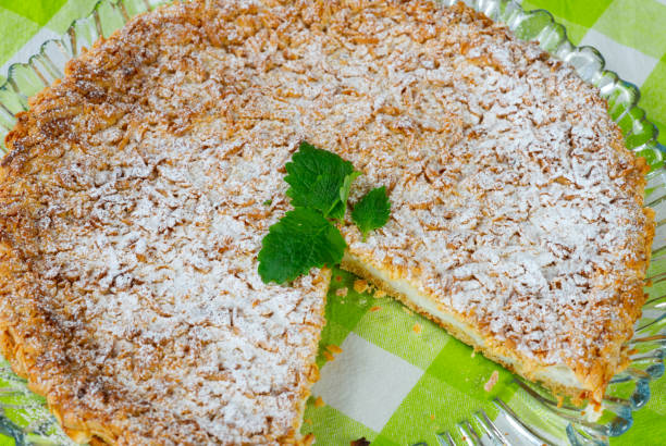 istock Yogurt pie from sprinkled dough with mint leaf on a tray 1323073695