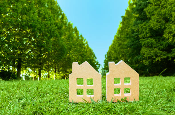 istock Miniature houses and blue sky 1323074521