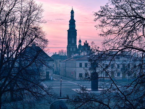 the old market square in Radom in the rays of the rising sun, old town in the glare of the rising sun