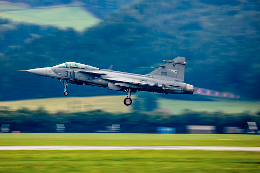 Zeltweg, Austria - September 6, 2019: Military fighter jet plane at air base. Air force flight operation. Aviation and aircraft. Air defense. Military industry. Fly and flying.