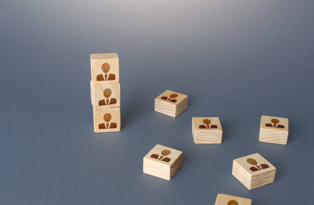 istock Figurine block tower with people. Hierarchical system. Company organization. Hiring, recruiting. Team building personnel leadership. Effective productive business employees group collectives. 1323081417