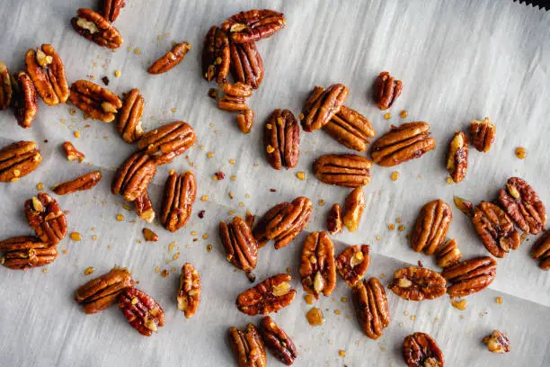 Candied pecans with honey, nutmeg, and red pepper flakes