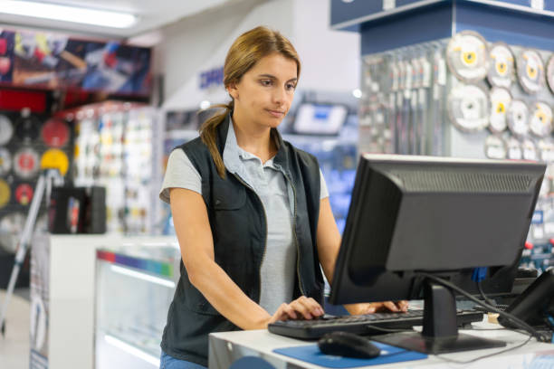 istock Woman working at the teller at a hardware store 1323082776