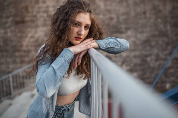 istock Beautiful woman on bleachers after practice 1323083748