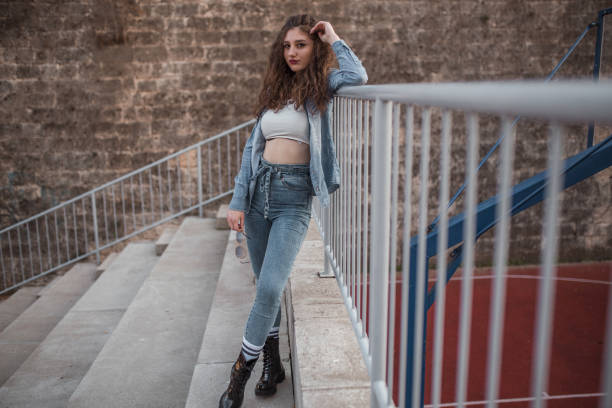 istock Handsome young woman on bleachers after practice 1323083875