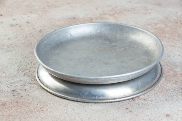 istock Old metal plates for scales on concrete background. 1323083978