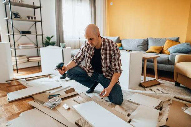 istock Mature man assembling furniture at home 1323088440
