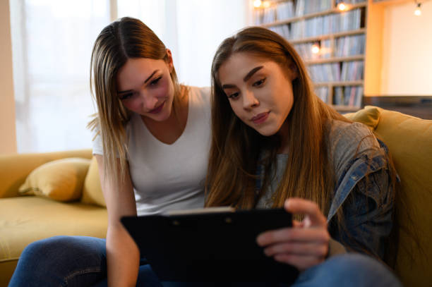 istock Young students studying for their exam together at home 1323090971