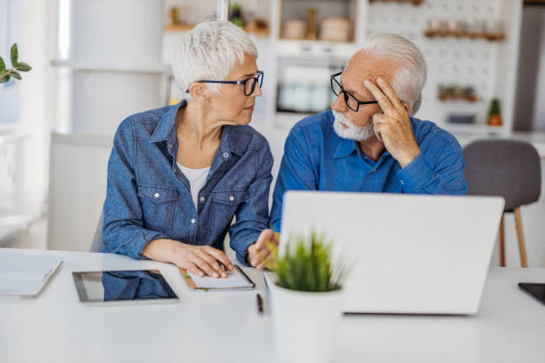 istock Senior couple at home office 1323096443
