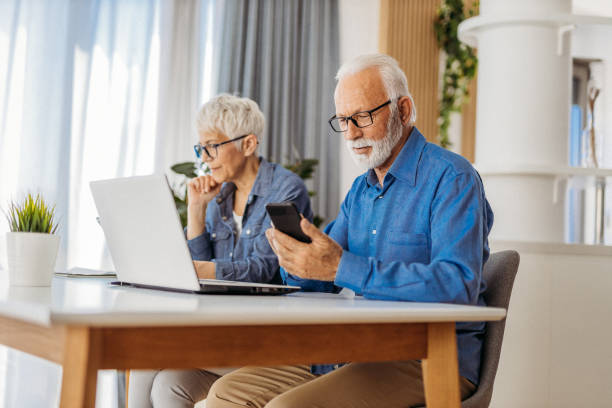 istock Senior couple at home office 1323097188