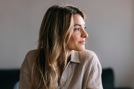 Close up photo of cheerful businesswoman sitting at home office desk