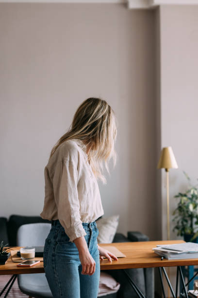 istock Unrecognizable Woman Standing in Home Office 1323098117