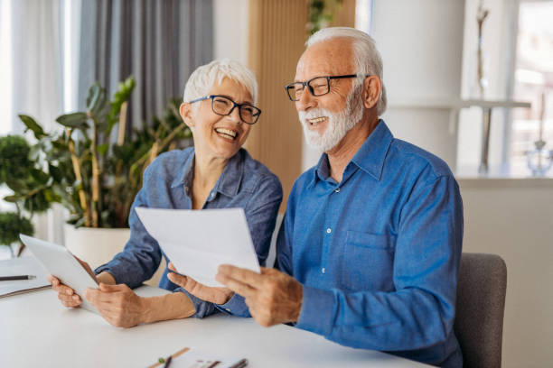 istock Senior couple at home office 1323100717
