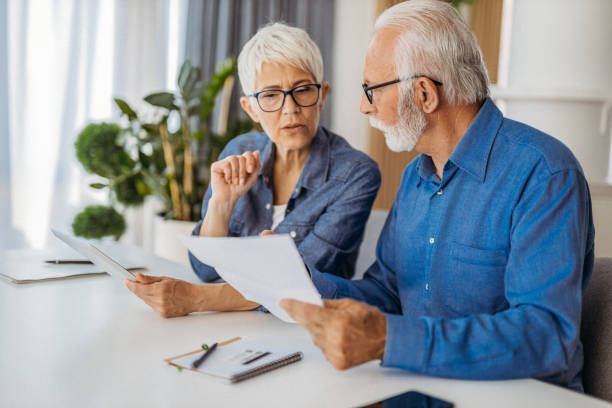istock Senior couple at home office 1323100748
