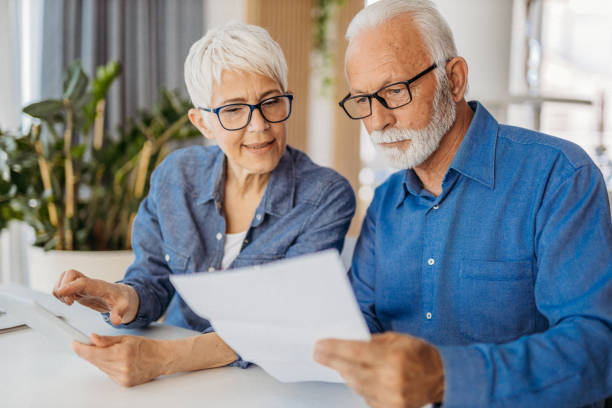 istock Senior couple at home office 1323100768