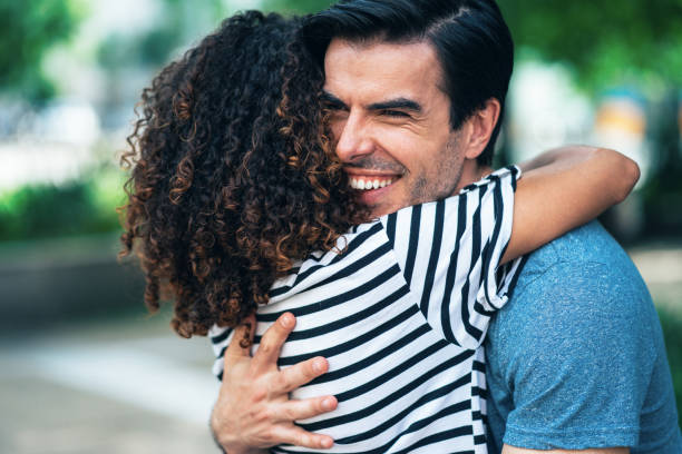 istock Couple hugging outdoors 1323102943