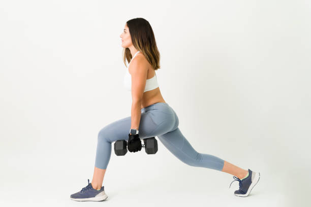 istock Exercising my legs and toned body with weights 1323104753