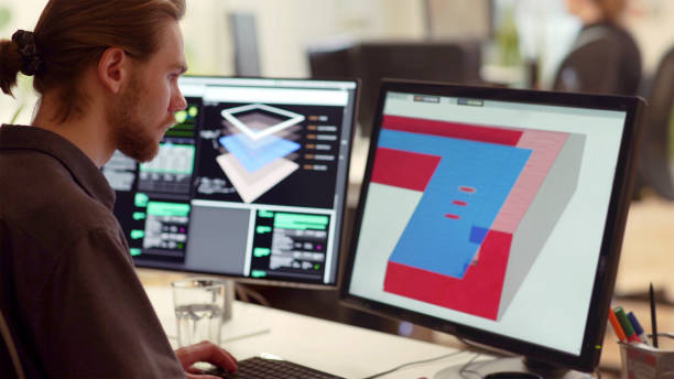 CAD solar panel detail Close up stock image of a bearded young man working at a computer screen. He’s working on CAD software designing a component for a solar panel. architect office stock pictures, royalty-free photos & images