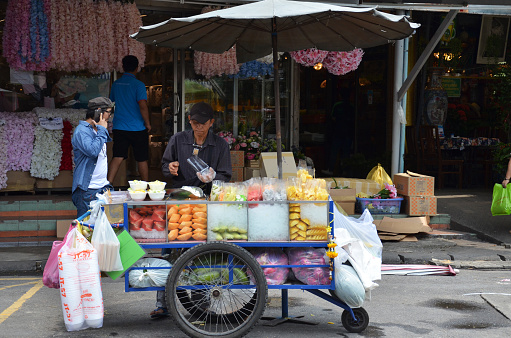 Bangkok, Thailand- Jun 19, 2016: Thai people sale fruits at Chatuchak weekend market in Bangkok, Thailand. It is the most popular weekend market in Bangkok.