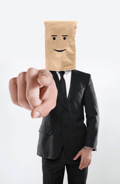 Happy manager Happy manager making a gesture to the camera anonymous businessman with paper bag on his head stock pictures, royalty-free photos & images
