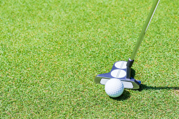 istock putter and golf ball on the green 1323126684