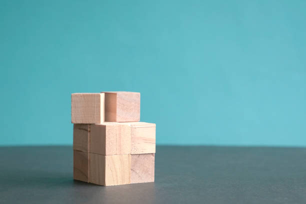 istock Wooden blocks on blue background 1323129889