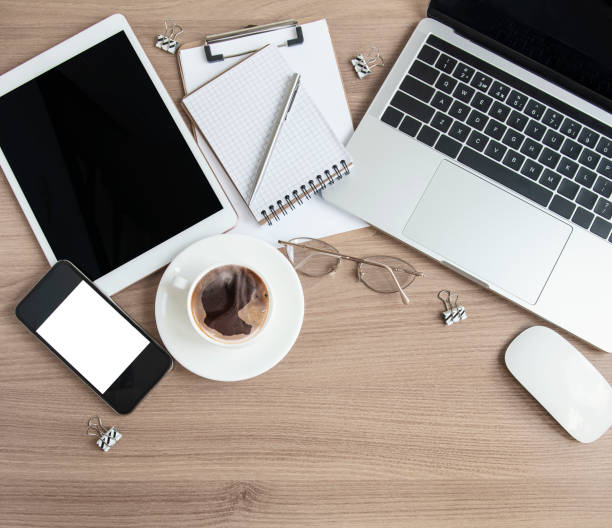 istock Laptop with office supplies  on the table. 1323135372
