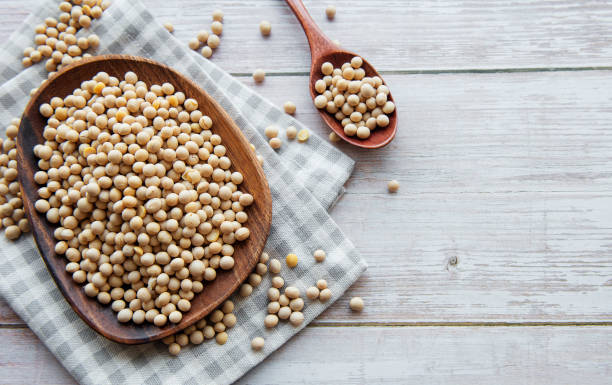 istock Soybeans on a wooden plate 1323135387