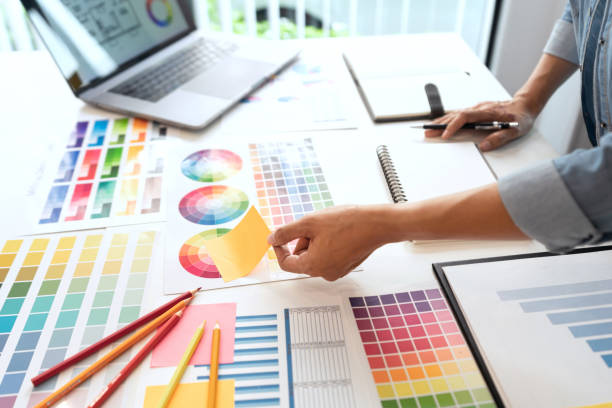 istock two designers discussing on the color tone for the excellent visual work. 1323136160