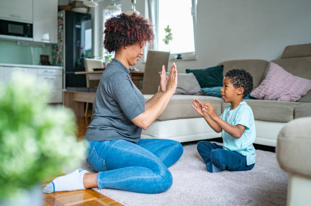 istock Mother playing with her son on the floor 1323136167