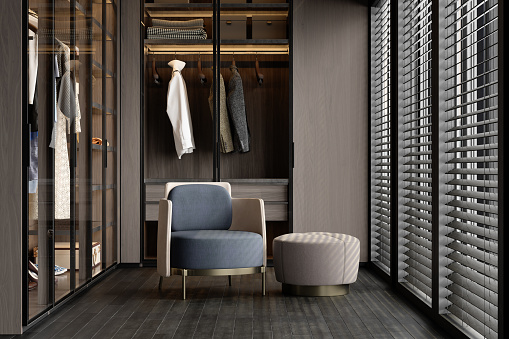 Vestidor de lujo con armario, sillón y Hassock photo
