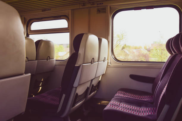 Empty seats in train wagon indoor. Interior lithuanian countryside travel. Empty seats in train wagon indoor. Interior lithuanian countryside travel. train interior stock pictures, royalty-free photos & images