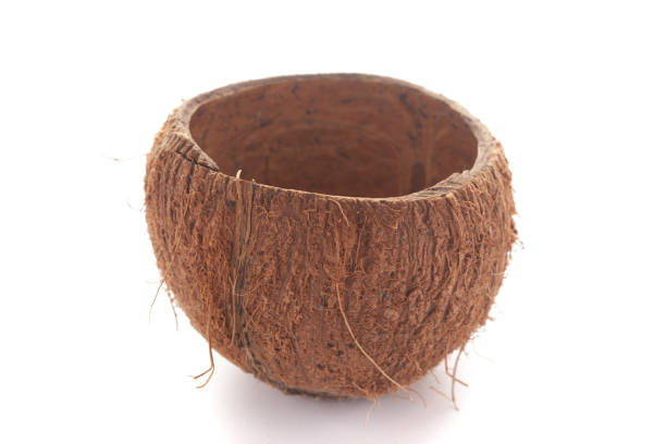 istock close-up of empty coconut shell bowl over white background. 1323142837