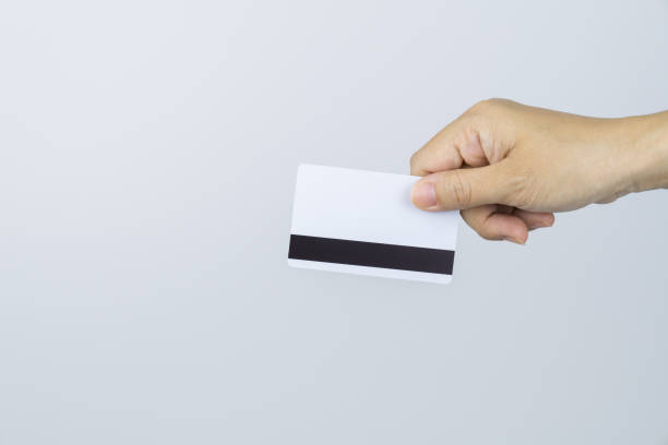 istock Female hand holds Credit Card on white background 1323146542